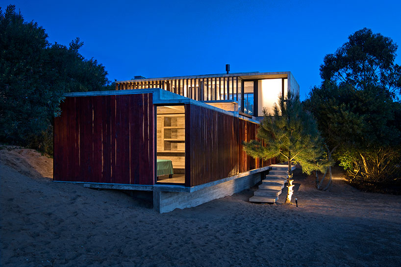 luciano kruk forms MR house of folded concrete and wooden louvers