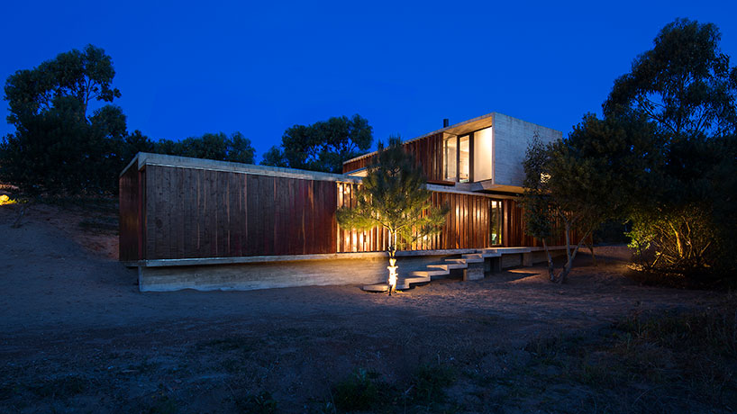 luciano kruk forms MR house of folded concrete and wooden louvers