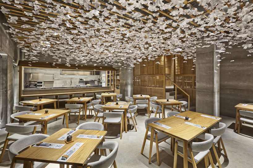 nozomi sushi bar by masquespacio designed as a japanese street