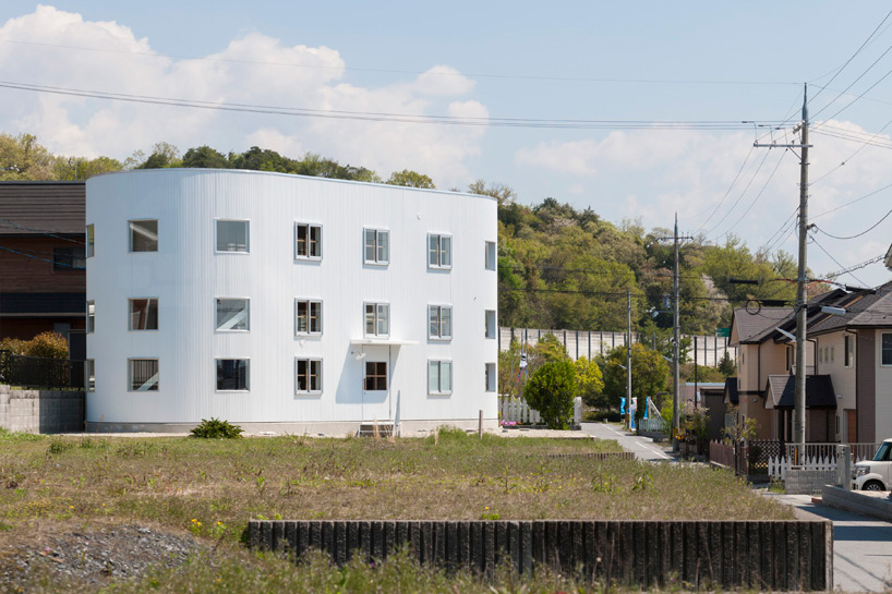 house in hikone by tato architects presents cylindrical façade of windows