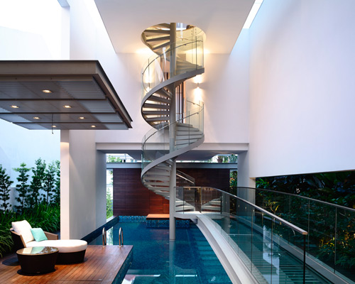 HYLA architects arranges singaporean home around spiral staircase