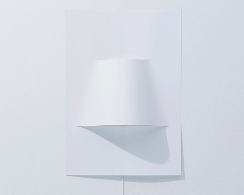 YOY design studio forms poster lamp with a single sheet of paper