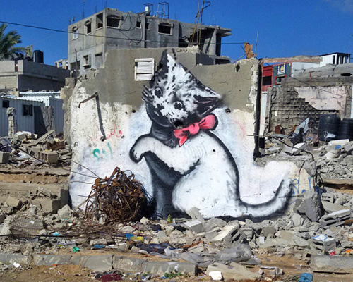 banksy sets his latest street interventions in war-torn gaza