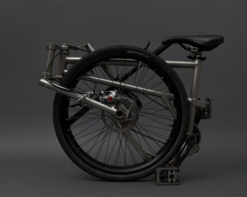 titanium helix folding bike efficiently compacts to its wheel size
