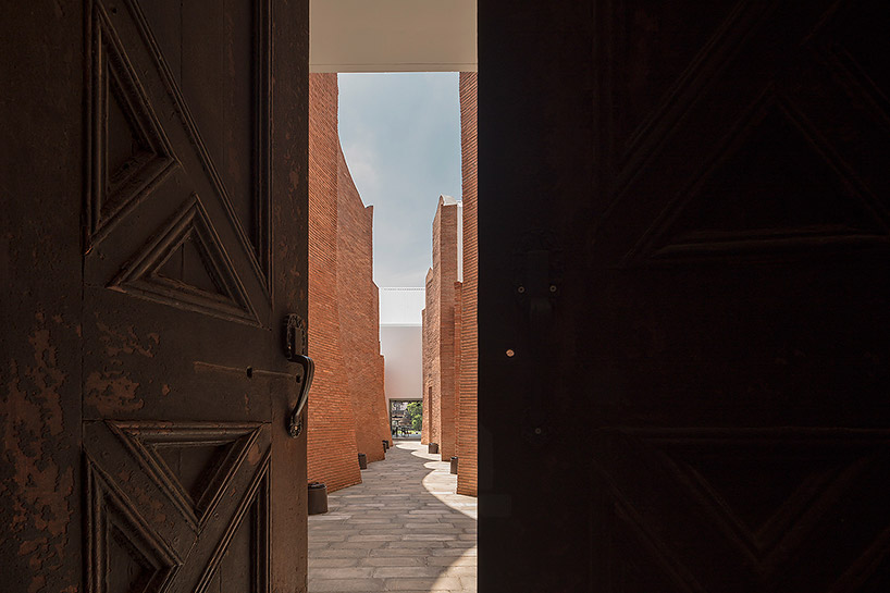 boutique hotel fuses multi-curved brick walls with pure white geometries