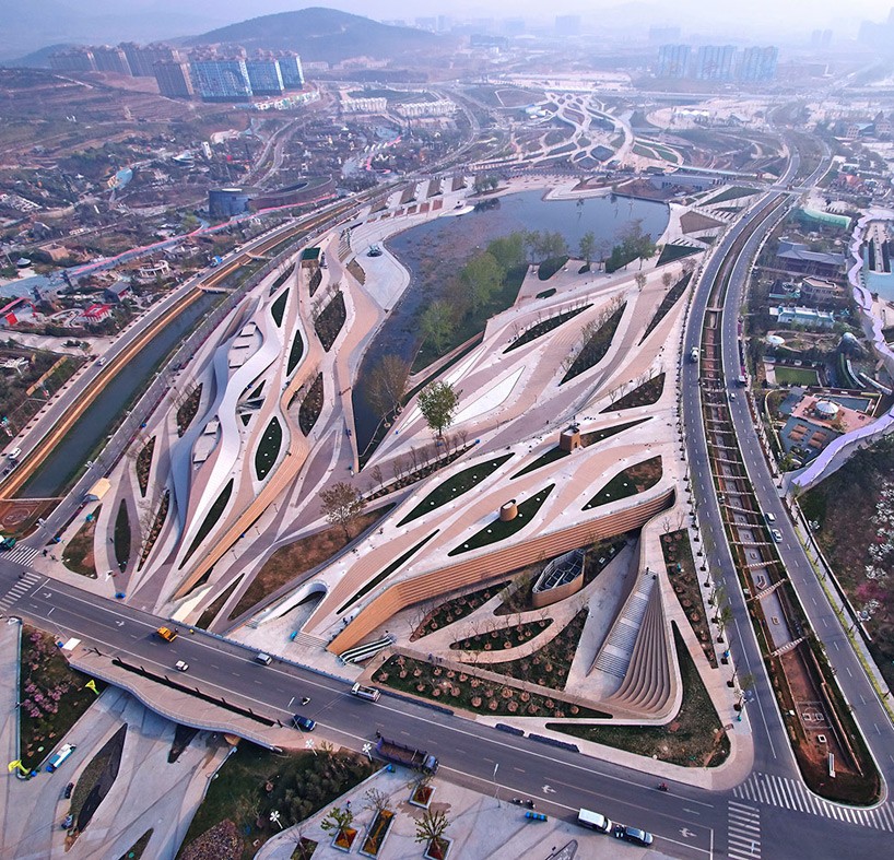 fluid diamond-shaped complex carved into landscape by HHD_FUN
