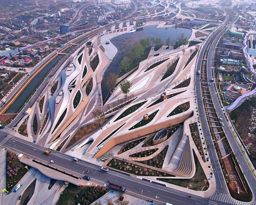 fluid diamond-shaped complex carved into landscape by HHD_FUN