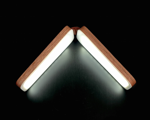 SIVU foldable table lamp by simo lahtinen opens and closes like a book