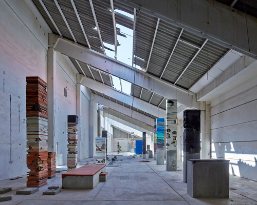 adrián villar rojas stacks mixed material columns at the sharjah biennial