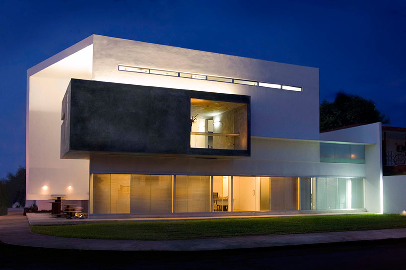 AS arquitectura fits three different offices into a concrete cube