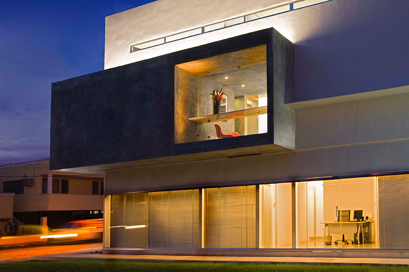 AS arquitectura fits three different offices into a concrete cube