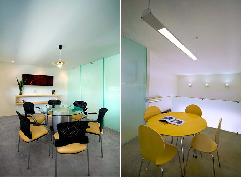 AS arquitectura fits three different offices into a concrete cube