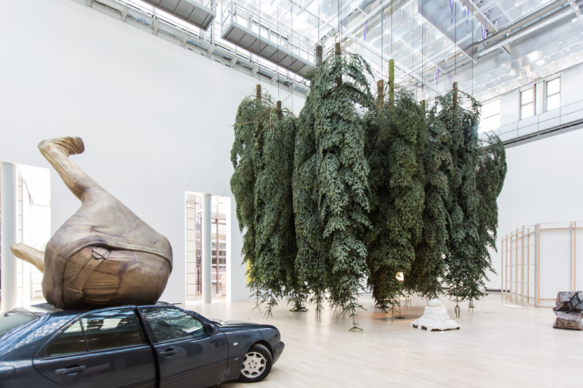 erwin wurm infills kunstmuseum wolfsburg with 'fat' objects and a german forest