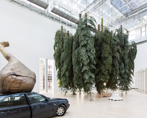 erwin wurm infills kunstmuseum wolfsburg with 'fat' objects and a german forest