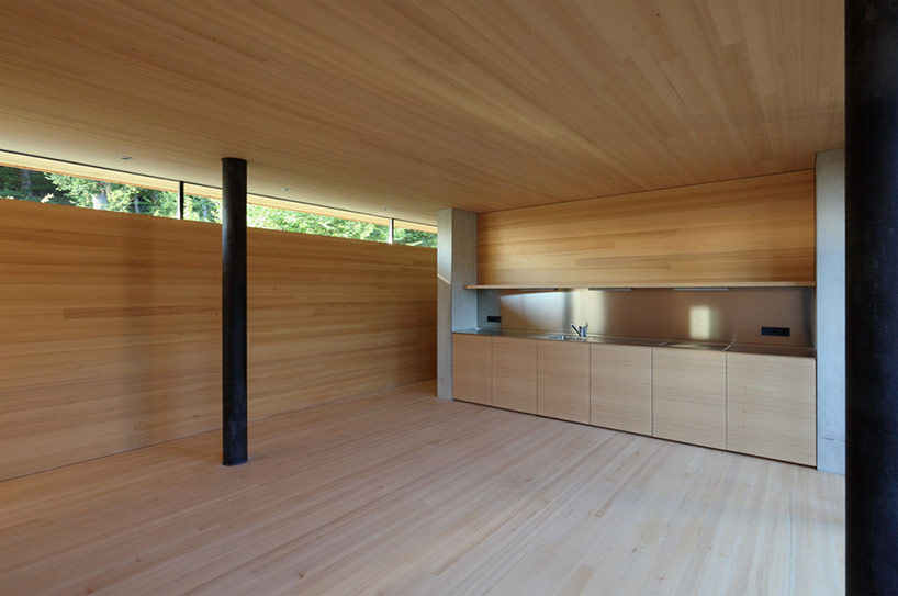 elmar ludescher architekt constructs haus am felsen over a valley in bregenz