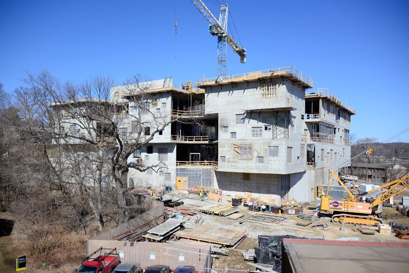 new visual arts building by steven holl for university of iowa celebrates topping out