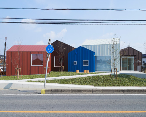 a cluster of gabled volumes comprises roote's animal hospital in japan