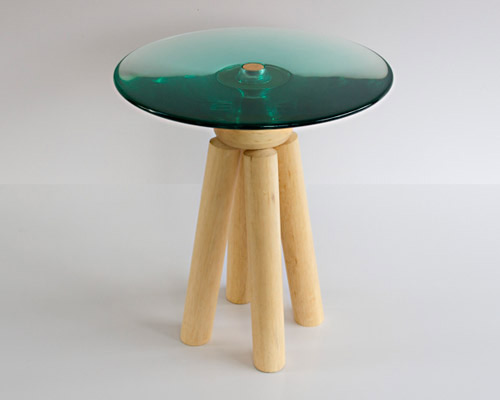 luciano santelli combines turned wood and cast resin in conica table