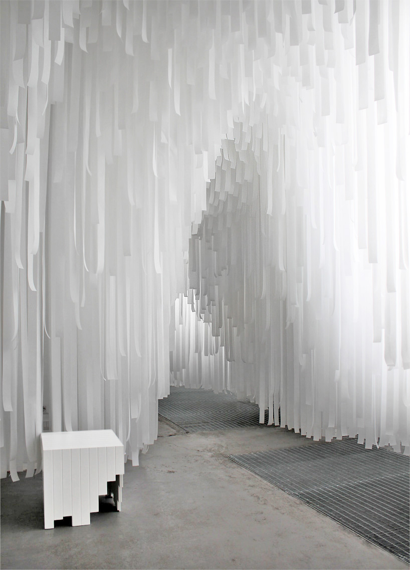 COS x snarkitecture turn milan's spazio erbe into a cavernous fabric retreat