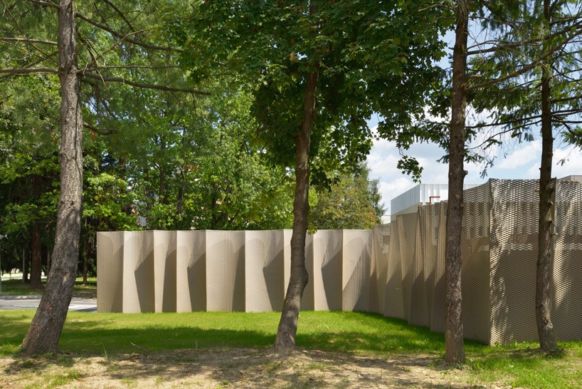 enota architecture clads valenje carpark with pleated metal façade