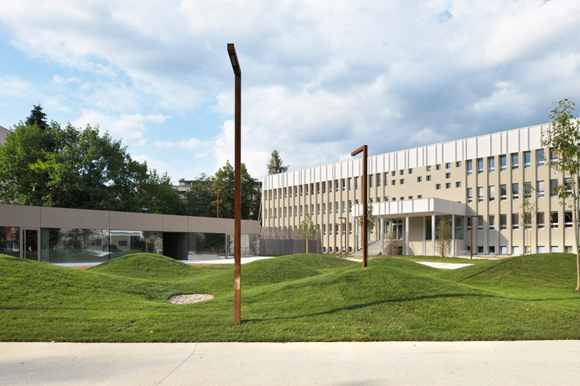 enota architecture clads valenje carpark with pleated metal façade