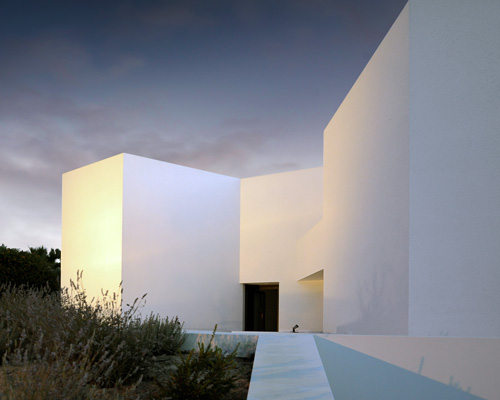 montenegro architects contains tróia residences within abstract white volumes