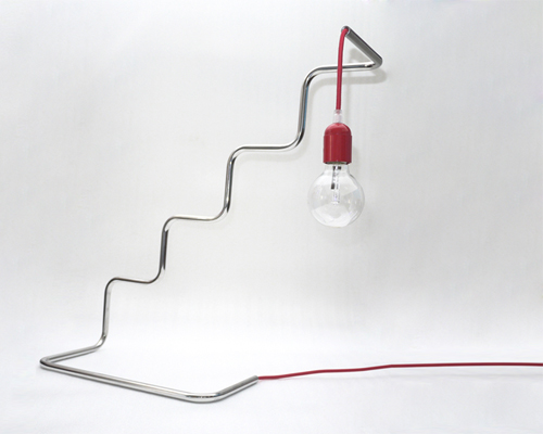 pietro travaglini creates tubino series of seemingly unstable lamps