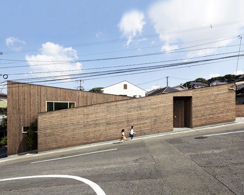 roote angles two-storey family residence on an inclined plot in japan