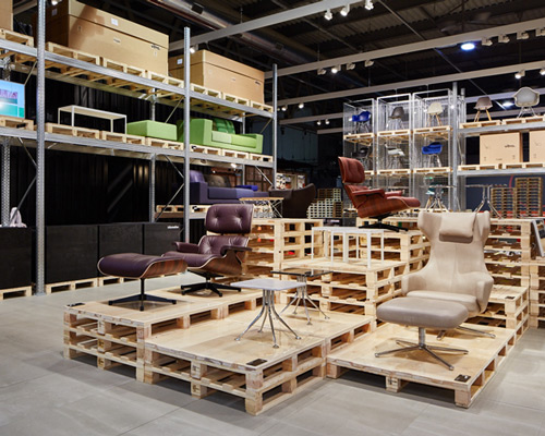 schemata's temporary warehouse showcases VITRA furniture at salone del mobile