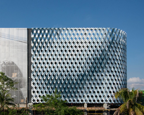 iwamotoscott clads city view garage with a perforated aluminum façade