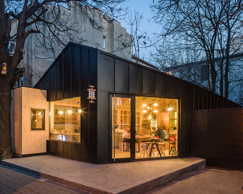 not a number architects envisions bucharest juice bar as an urban cabin