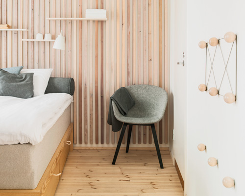 studio puisto places hotel rooms as separate units inside converted warehouse