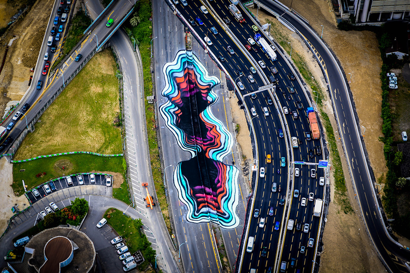 giant trompe l'oeil painting appears to break through paris highway