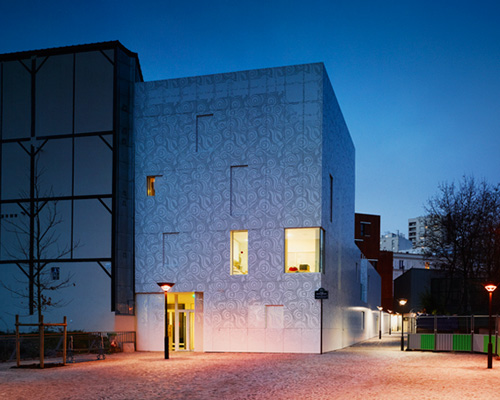 avenier cornejo's playschool in paris features a perforated patterned façade