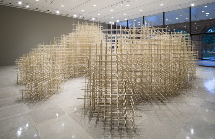ben butler deploys over 10,000 sticks of poplar wood for unbounded installation