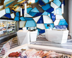 jean de lessard wraps némeau seafood shop in quebec city with glass prisms
