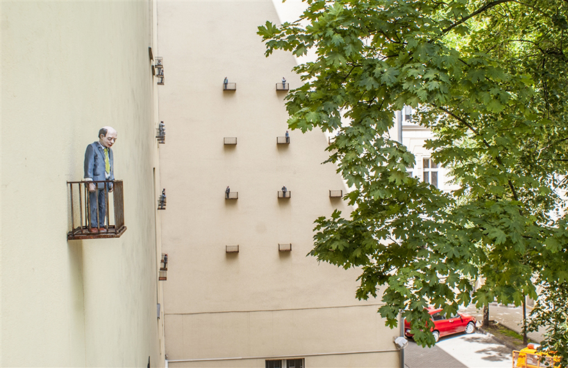 isaac cordal cages isolated miniatures in the modern outdoors