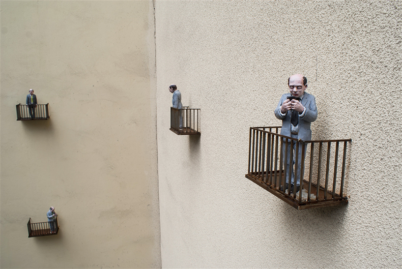 isaac cordal cages isolated miniuatures in the modern outdoors