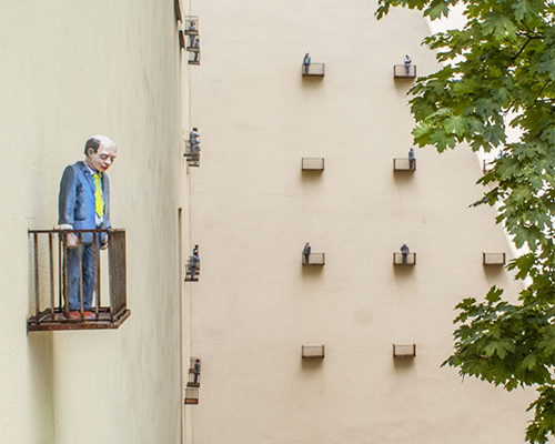 isaac cordal cages isolated miniatures in the modern outdoors