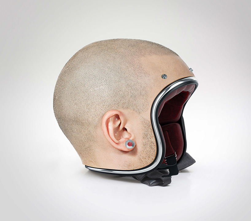 jyo john mulloor models a set of custom-made human head helmets