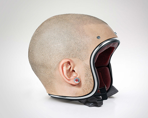 jyo john mulloor models a set of custom-made human head helmets