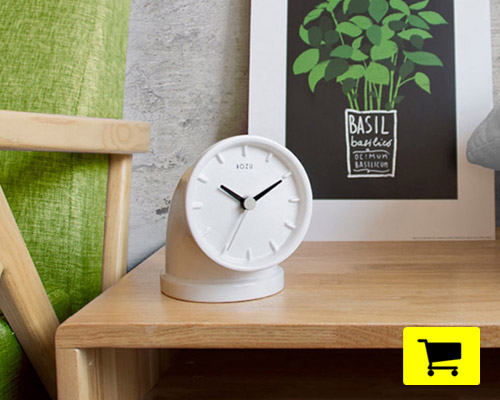 bozu's plumber clock adapts the form of an elbow joint for desktop use