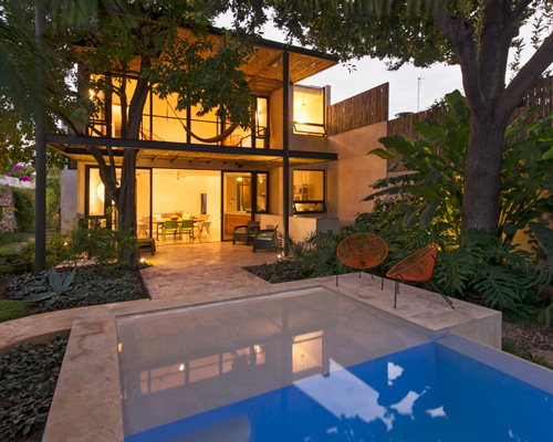 reyes ríos + larraín arquitectos hides casa GG15 behind an elongated pool