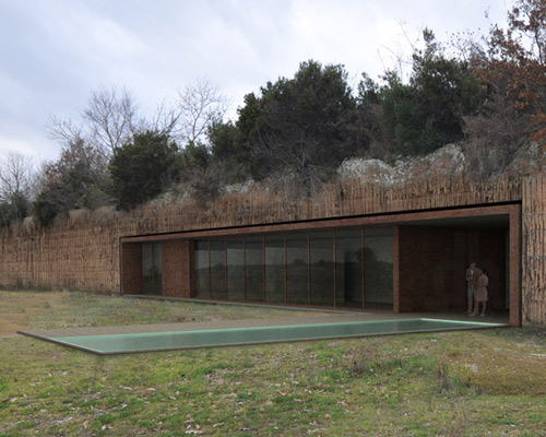 house in the rock by romano adolini emerges from abandoned quarry bluff