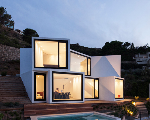 cadaval & solà morales protrudes sunflower house from mediterranean cliffside