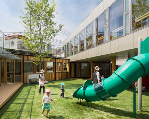 tadashi suga articulates takeno kindergarten around a courtyard playground