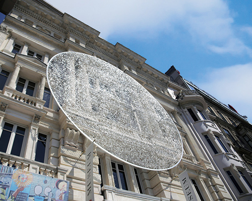 artists sculpt shimmering disk in istanbul with 14,000 eyeglass lenses