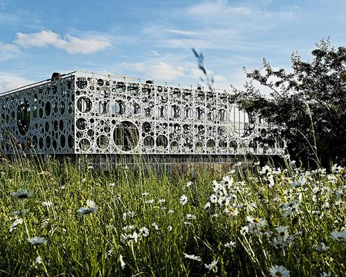 C.F. møller shrouds university research building with perforated panels