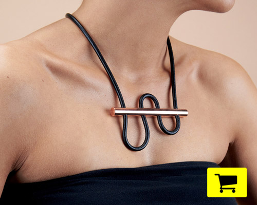 180° necklace incorporates solid copper rod with woven leather