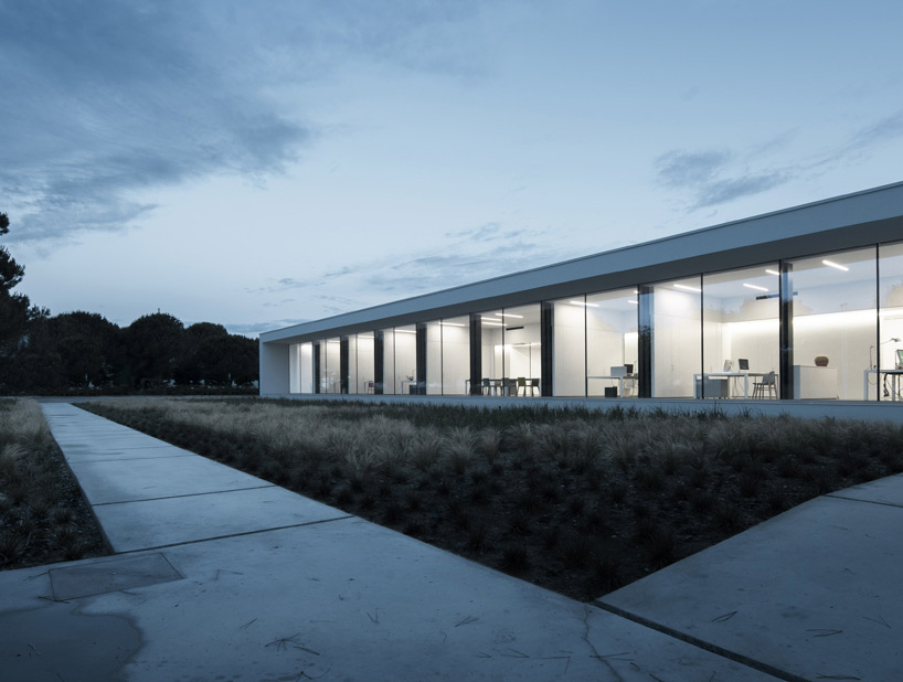 kristalia's headquarters harmoniously blends man-made and nature
